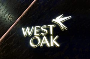 This sign was fabricated using a halo-lit combination with a front-lit channel letter sign for a real estate sales centre named West Oak. Photos courtesy Futech