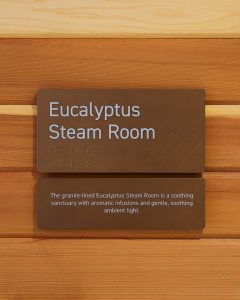 The interior signage package also included signage for communal spaces, such as the Eucalyptus Steam Room and Halotherapy Salt Room.