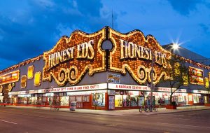 After six years, one of the bright, glimmering signs synonymous with former bargain retailer Honest Ed’s is coming home to its original location in Toronto. Photo © Bigstock