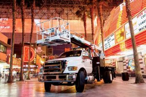 Boom trucks, the industry’s work horses, are dual rated for crane and personnel lifting, taking installers and their projects to new heights. Photos courtesy Altec, Inc.