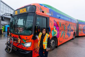 The bright orange and blue TransLink bus wrap, created to celebrate Vaisakhi.