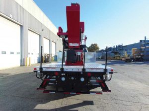 Stabilizers coming down from a boom truck.