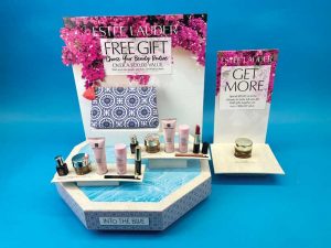 A counter display for a free gift from Estee Lauder.