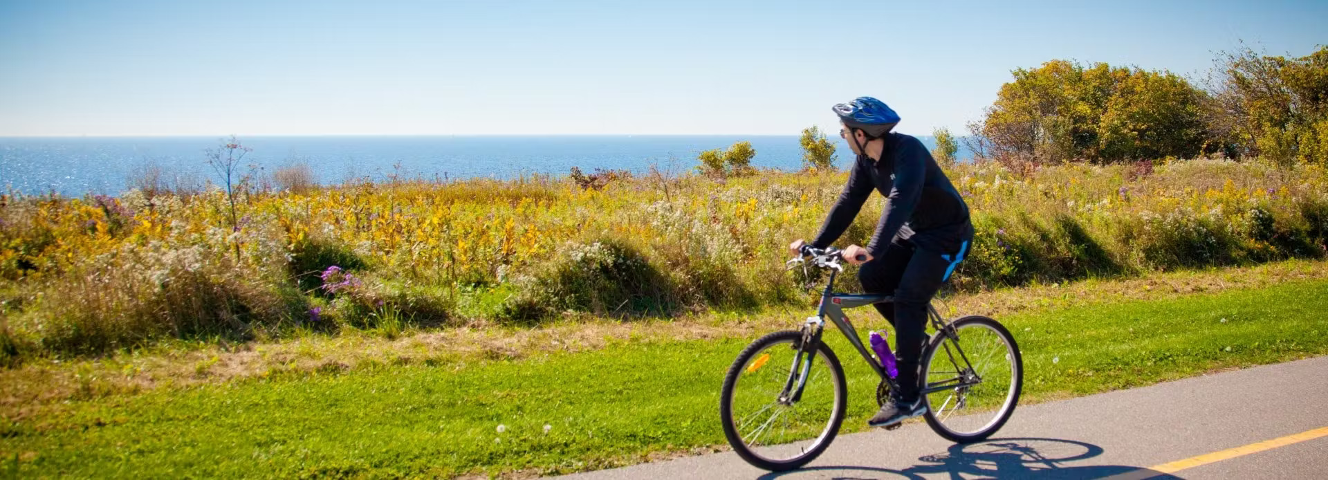 A person cycling along the road. 