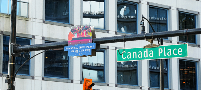 Two street signs, one which reads "Canada Place", and the other, which displays the art made by artist Jag Nagra. 