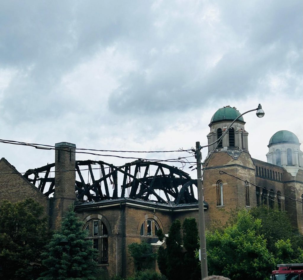 A front view of the church with its roof burned down. 